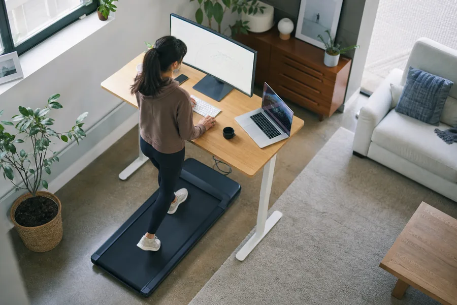 desk-based workers comparing walking pad home office for long desk days leave little time for movement, but the office cannot permanently become a gym.
