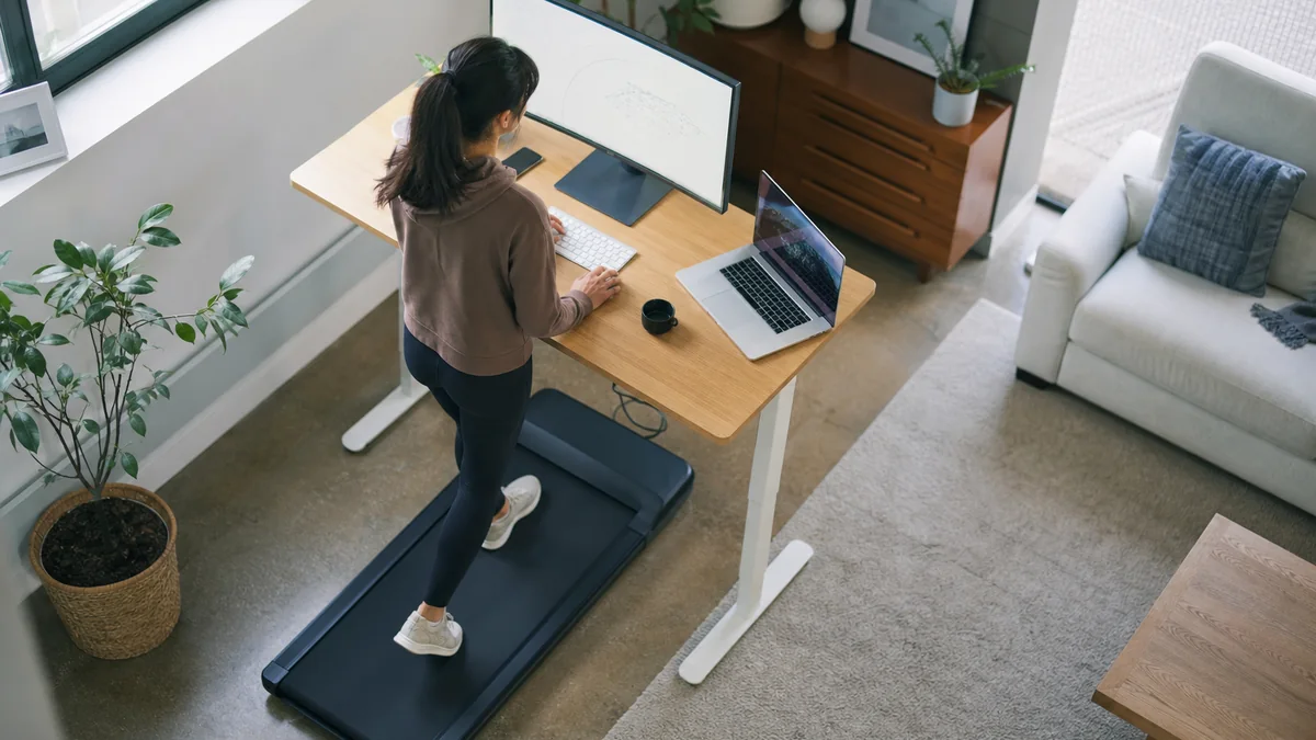 walking pad home office shown in the real-life setting: Long desk days leave little time for movement, but the office cannot permanently become a gym.
