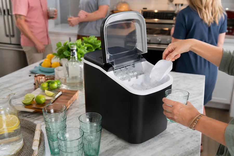frequent hosts comparing countertop ice maker for a small freezer cannot keep up when friends arrive for iced drinks on a hot afternoon.