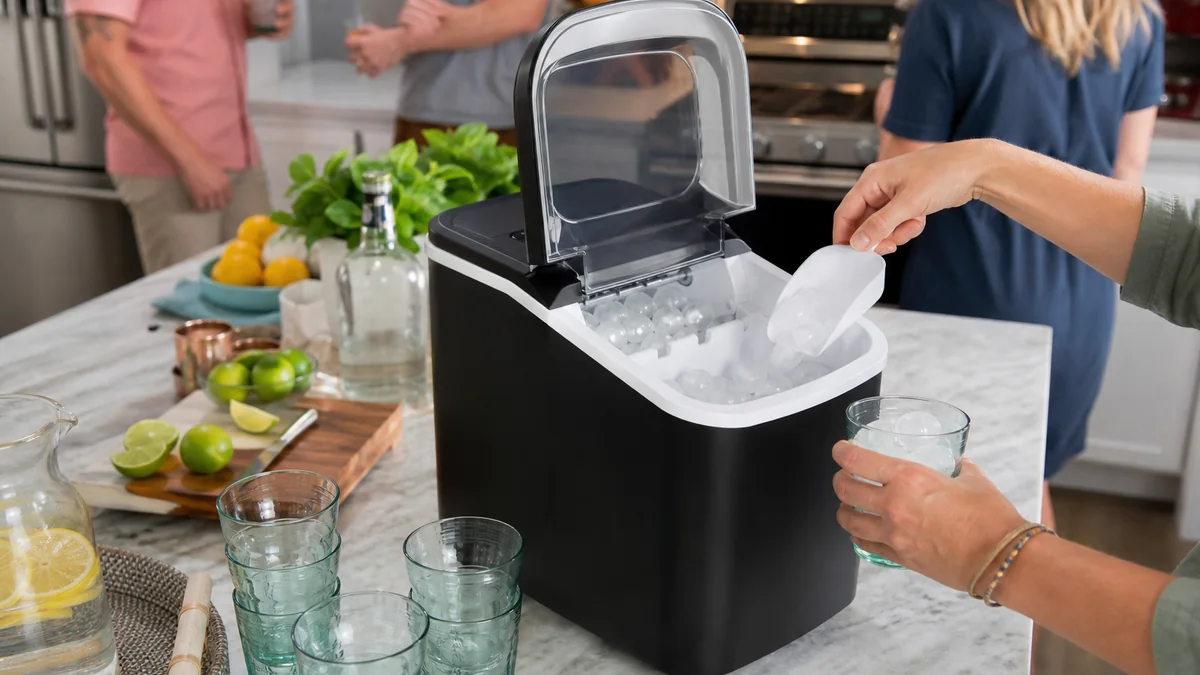 countertop ice maker shown in the real-life setting: A small freezer cannot keep up when friends arrive for iced drinks on a hot afternoon.