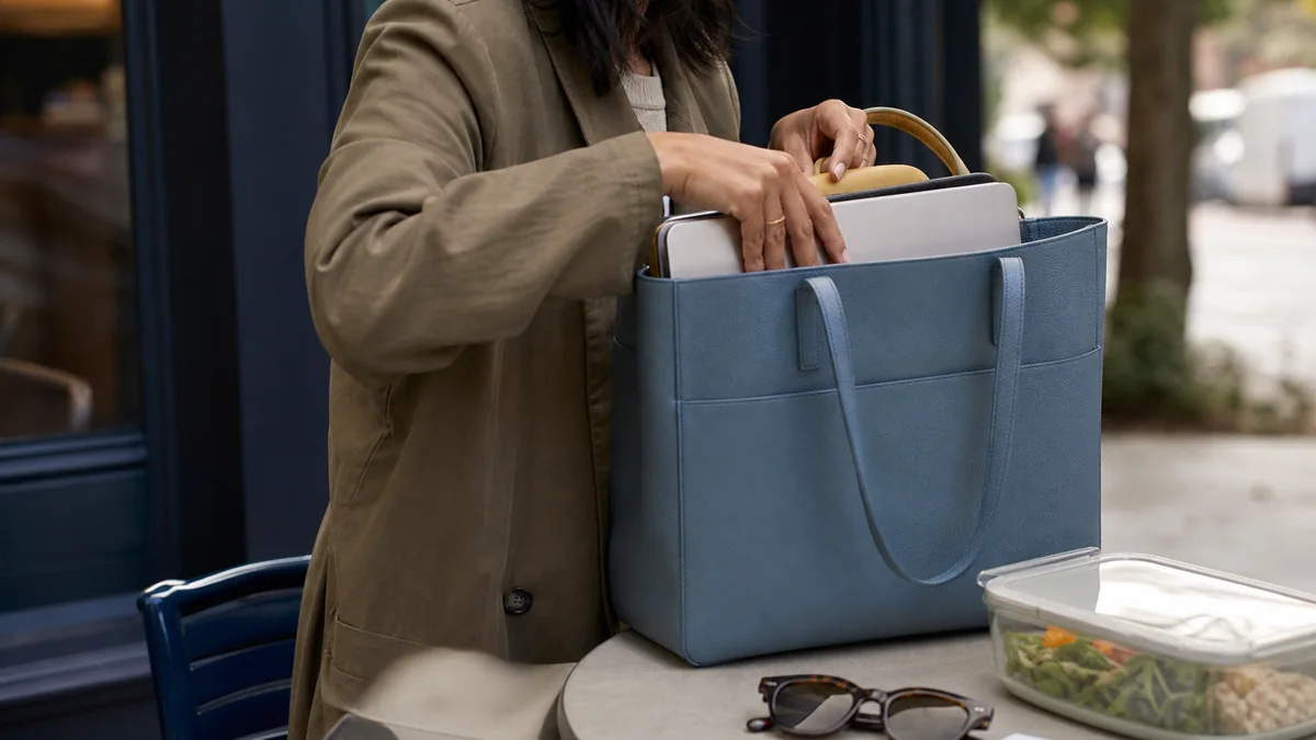 structured everyday tote bag shown in the real-life setting: A single bag carries a laptop, lunch, sunglasses, and the receipt you need to find later.