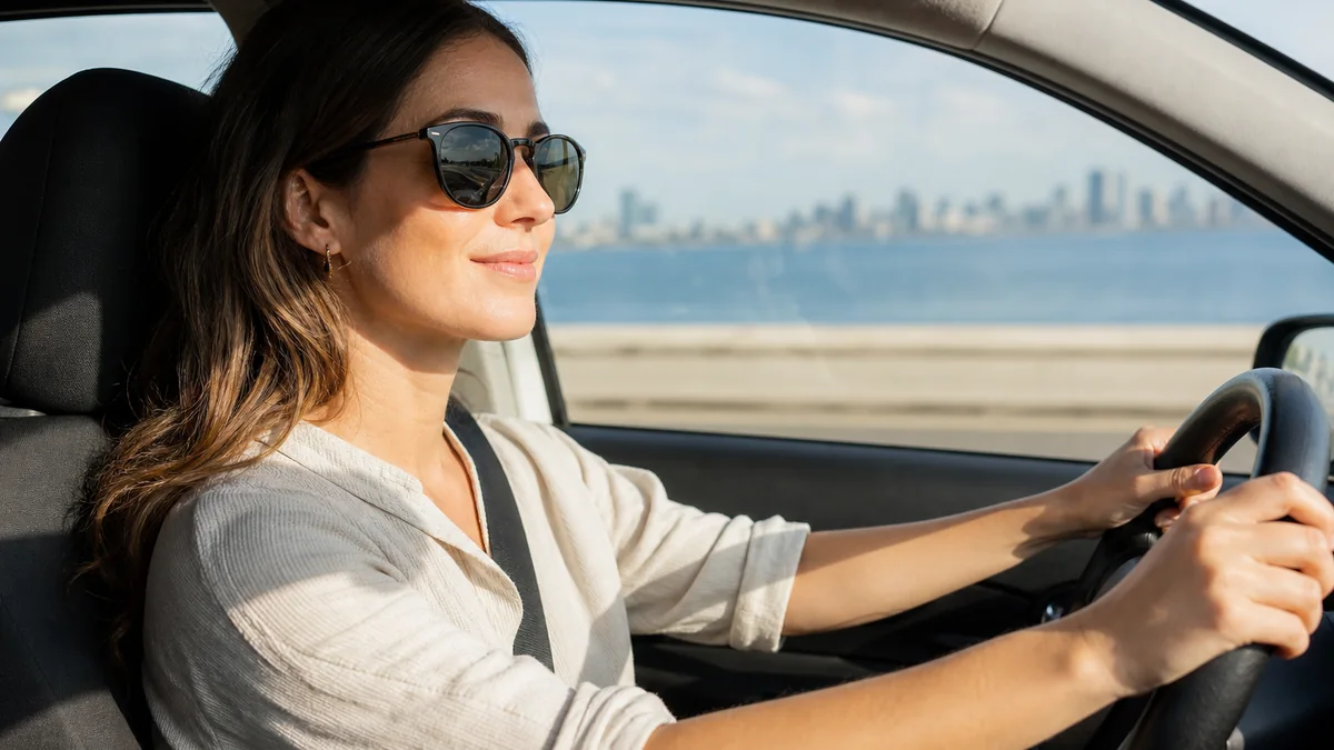 polarized sunglasses everyday shown in the real-life setting: Glare changes between the windshield, sidewalk, and water, but one pair needs to cover most days.