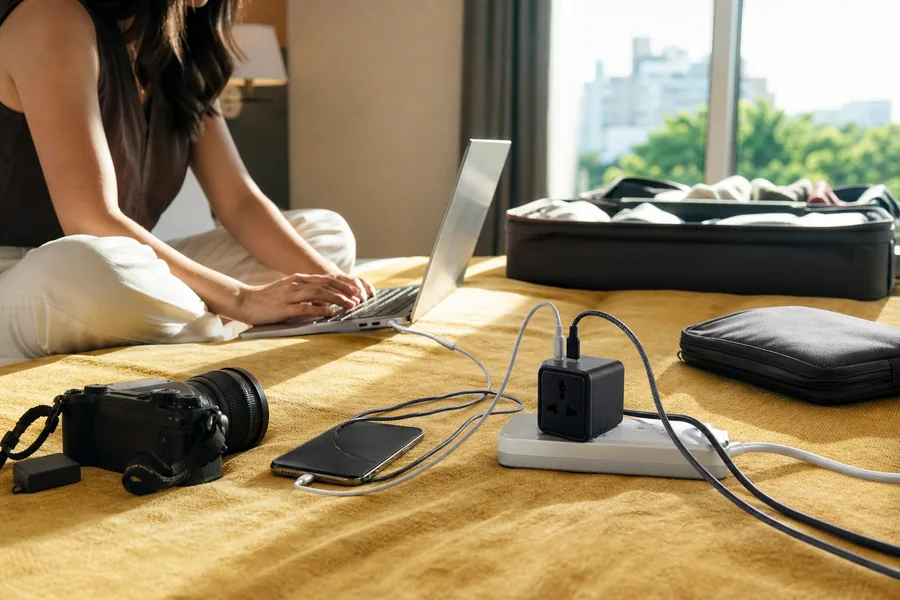 international travelers comparing universal travel adapter usb c for a phone, laptop, and camera charger need to work across two countries without a bag of loose plugs.
